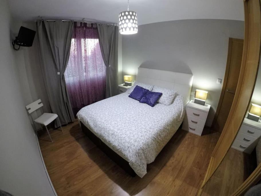 Posteľ alebo postele v izbe v ubytovaní Apartamento Rachel