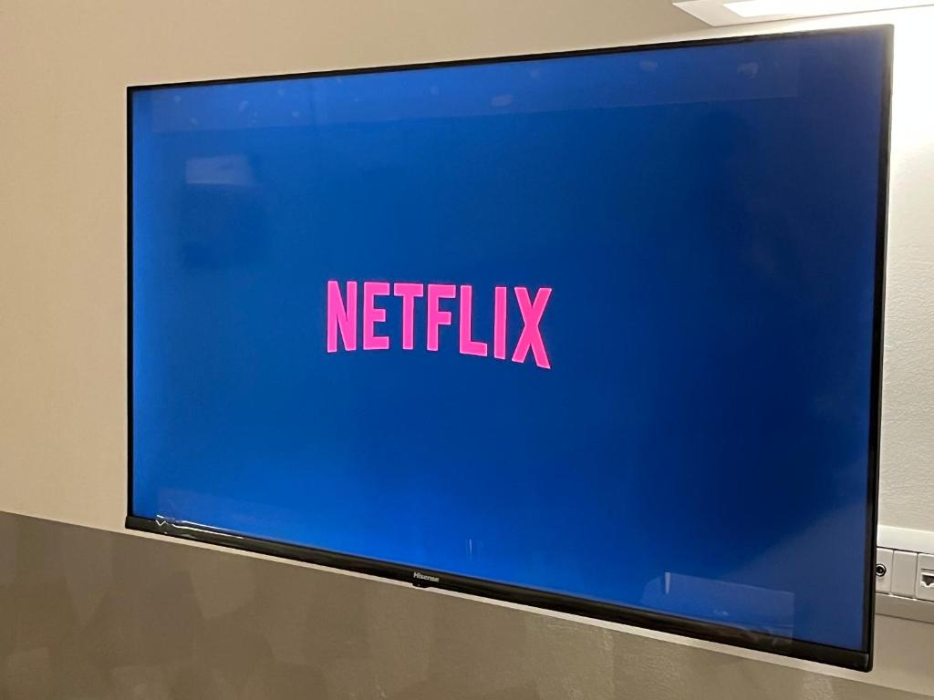TV a/nebo společenská místnost v ubytování Bergamo Automatic Rooms Self check-in