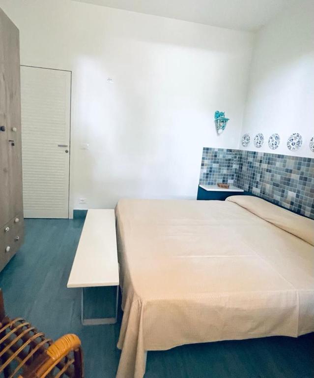 Postel nebo postele na pokoji v ubytování Antonia's Home - casa per le vacanze con giardino e veranda attrezzati