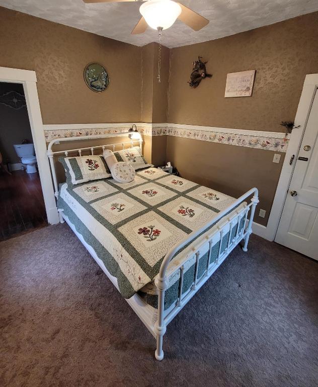 a bedroom with a bed in a room at Prairie House Manor Bed and Breakfast in De Smet