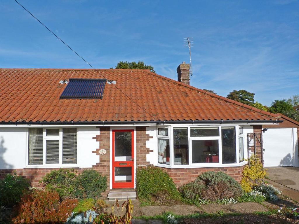 a house with a solar panel on the roof at Southbank in Mundesley