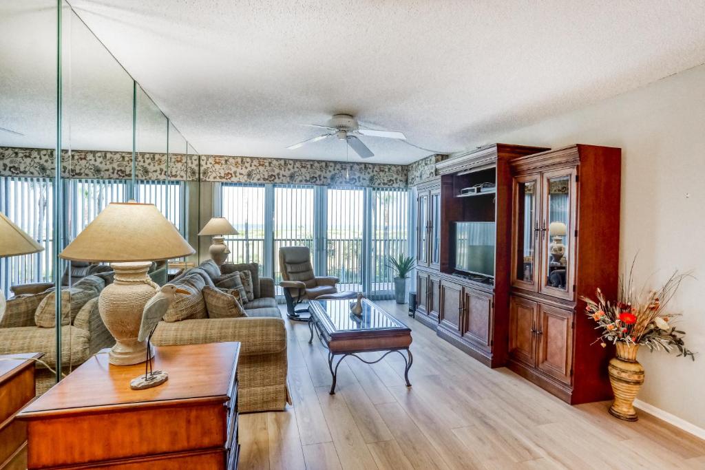 a living room with a couch and a table at Landmark Towers 203 in Clearwater Beach