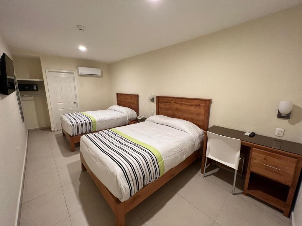 Postel nebo postele na pokoji v ubytování Hotel Baja