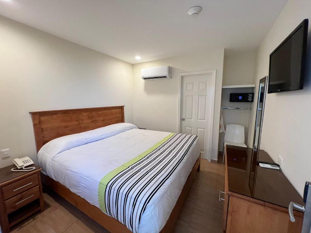 Postel nebo postele na pokoji v ubytování Hotel Baja