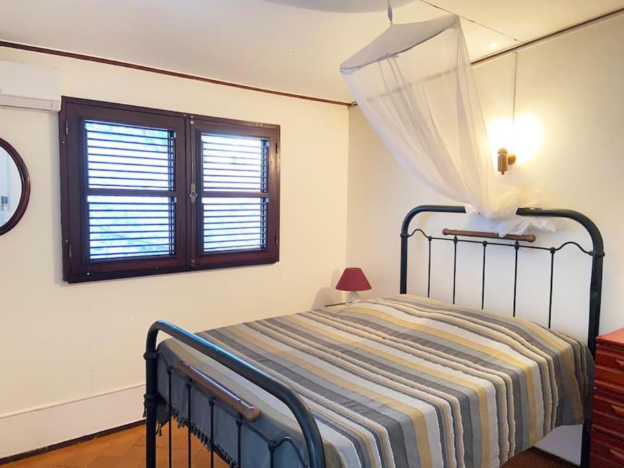 Postel nebo postele na pokoji v ubytování Le Caillou *** Belle villa, 4 chambres, piscine, vue mer ***