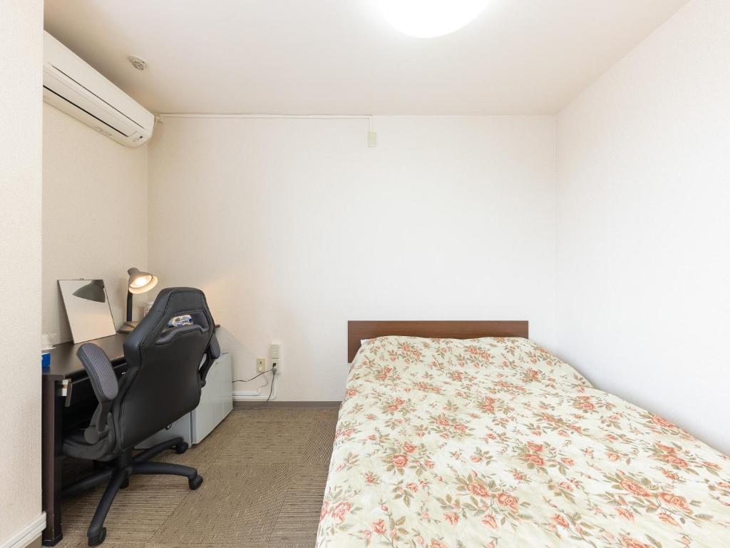 Postel nebo postele na pokoji v ubytování Tabist Tatebayashi Station Hotel