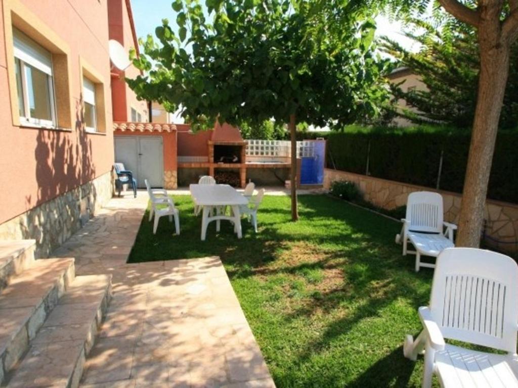 Vonkajšia záhrada v ubytovaní Villa con jardín y piscina privada para 8 personas en Las Tres Calas, cerca de Ametlla de Mar - HISP-217-7