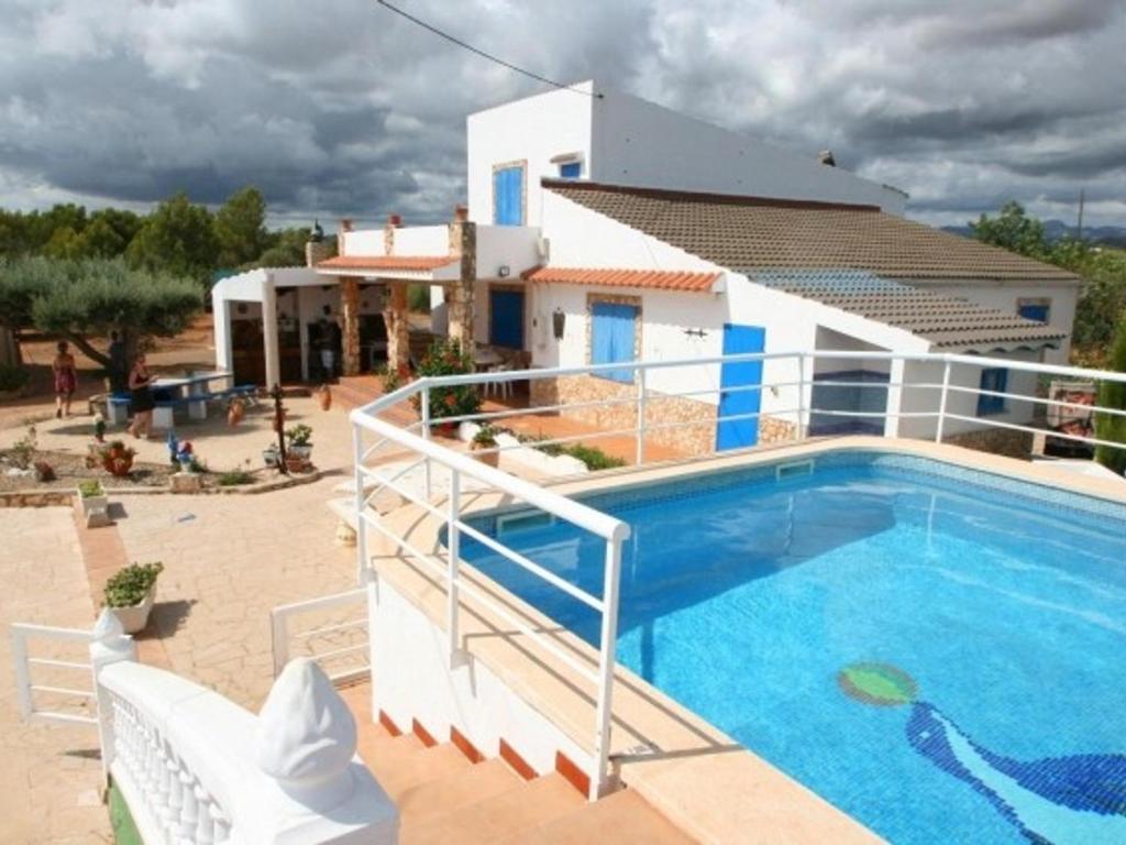 a villa with a swimming pool in front of a house at Villa L'Ametlla de Mar, 4 pièces, 6 personnes - HISP-217-4 in L'Ametlla de Mar