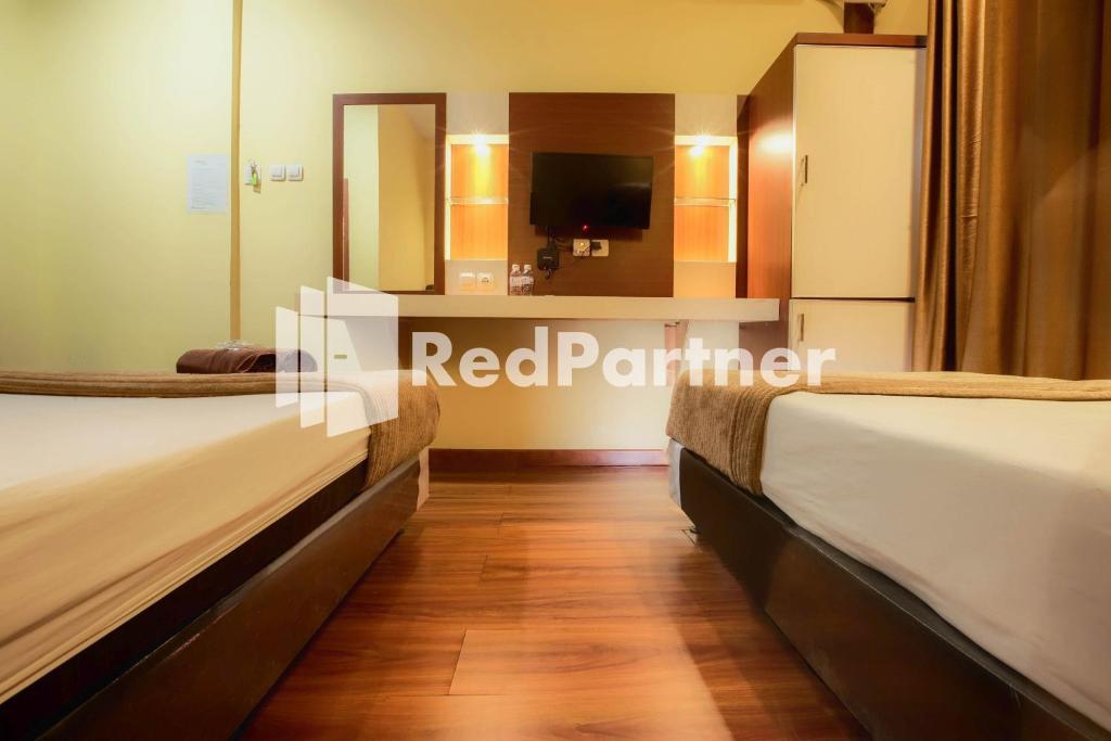 Hatta Guest House Syariah near Hayam Wuruk Jelutung Mitra RedDoorz - Twin Room