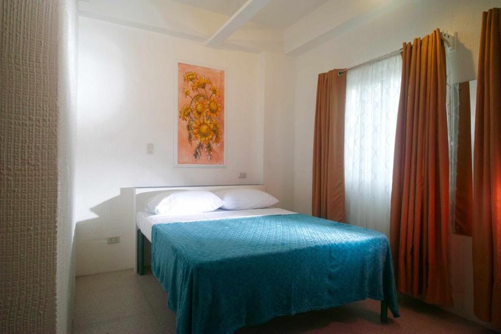 Postel nebo postele na pokoji v ubytování 1001 Nights Boutique Inn