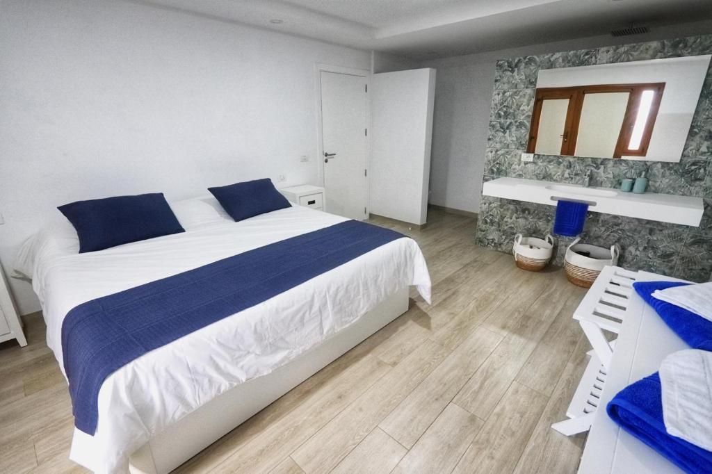 Postel nebo postele na pokoji v ubytování Vivienda vacacional Agripina