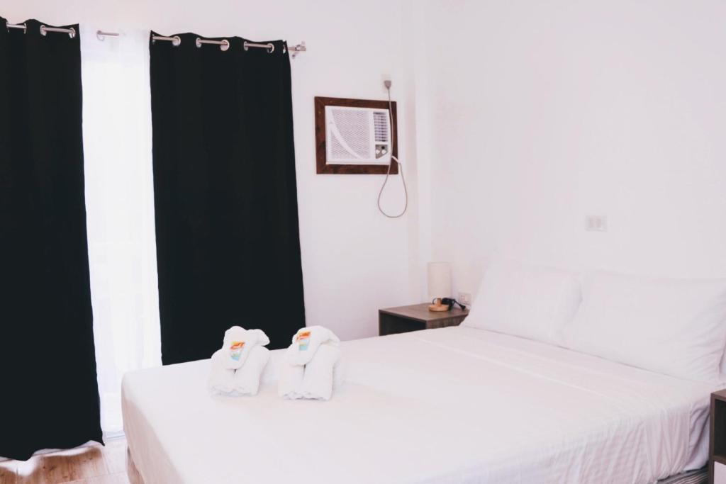 Postel nebo postele na pokoji v ubytování Meili Beach Resort
