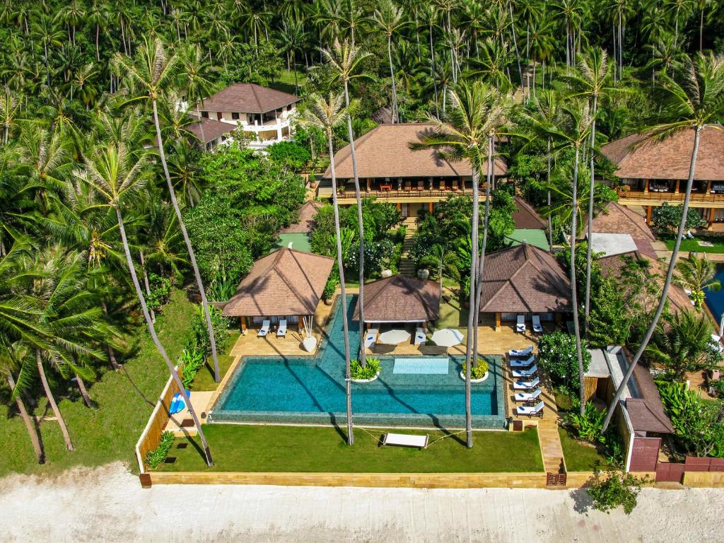 an aerial view of a resort with a swimming pool at Ban Mekkala in Laem Sor