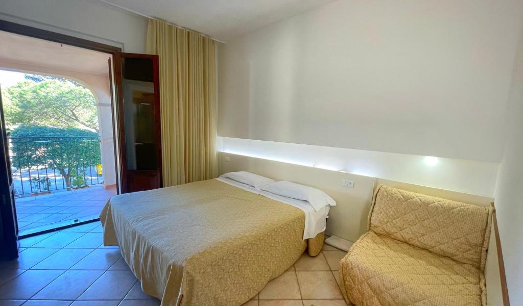 Postel nebo postele na pokoji v ubytování Hotel Boschetto