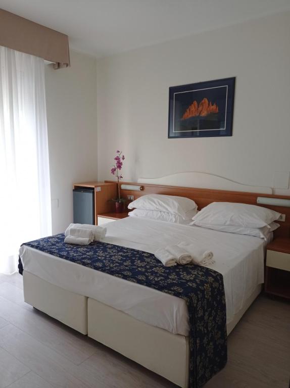 Postel nebo postele na pokoji v ubytování Hotel Verona