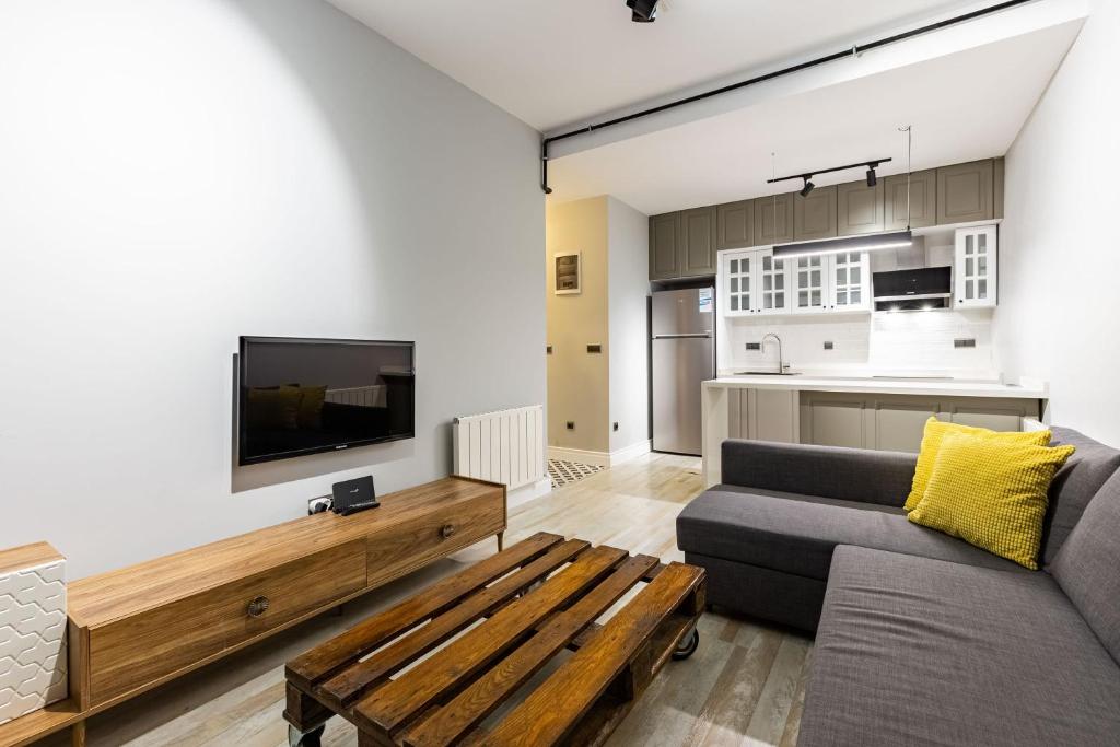 a living room with a couch and a table at Cozy Flat with Central Location in Moda Kadikoy in Istanbul