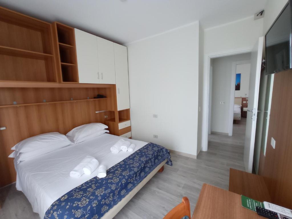 Postel nebo postele na pokoji v ubytování Hotel Verona