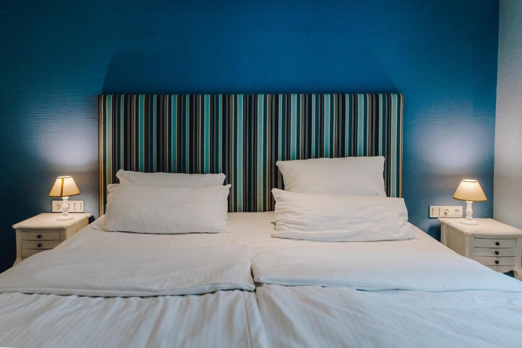 Postel nebo postele na pokoji v ubytování Little 7 - Boutique Hotel