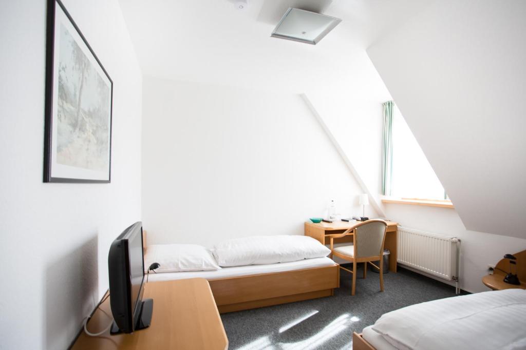 Postel nebo postele na pokoji v ubytování Hotel Hansenhof