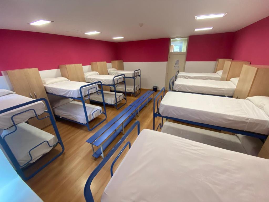 Cama o camas de una habitación en Tres Estrellas Camí de Sirga Mequinenza