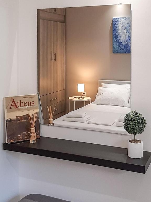 a bedroom with a bed with a sign on it at Byronico Acropolis Apartment by MPS in Athens