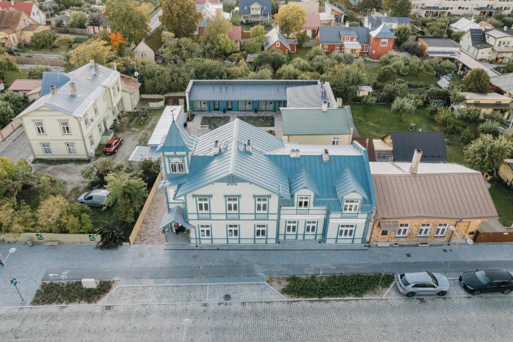 an aerial view of a large house with a blue roof at Villa Fannyhof in Haapsalu
