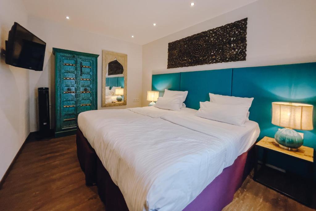 Postel nebo postele na pokoji v ubytování Little 7 - Boutique Hotel