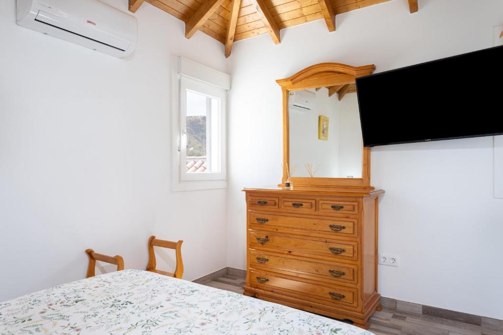Televízia a/alebo spoločenská miestnosť v ubytovaní Casa Isabela with Roque Nublo view