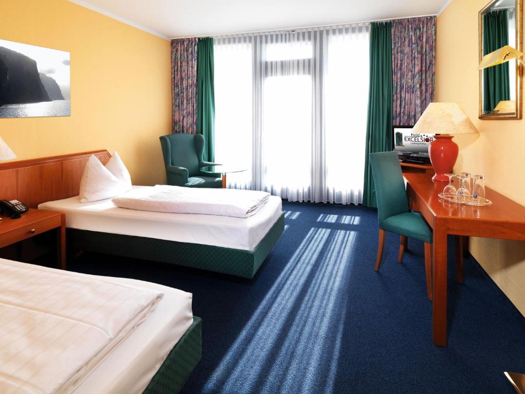 Postel nebo postele na pokoji v ubytování Hotel Excelsior Ludwigshafen