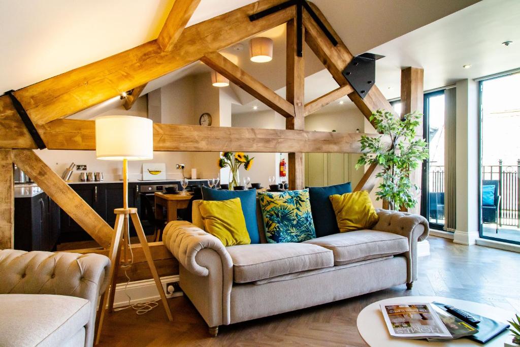 a living room with a couch and a table at Goodramgate Apartments in York