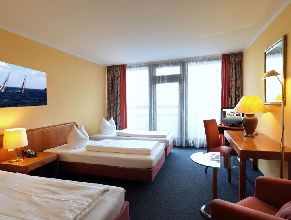 Postel nebo postele na pokoji v ubytování Hotel Excelsior Ludwigshafen