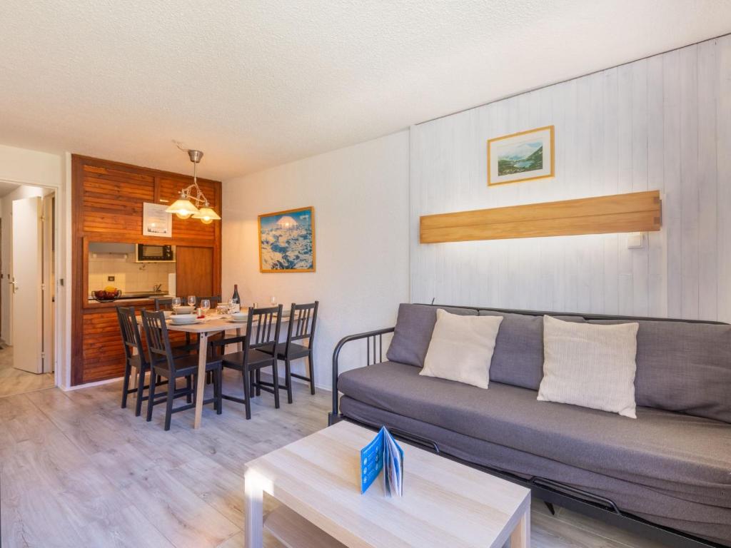 a living room with a couch and a table at Apartment Les Tommeuses - Val Claret-9 by Interhome in Tignes