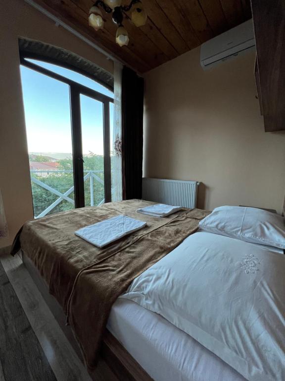 Postel nebo postele na pokoji v ubytování Guest House Lali