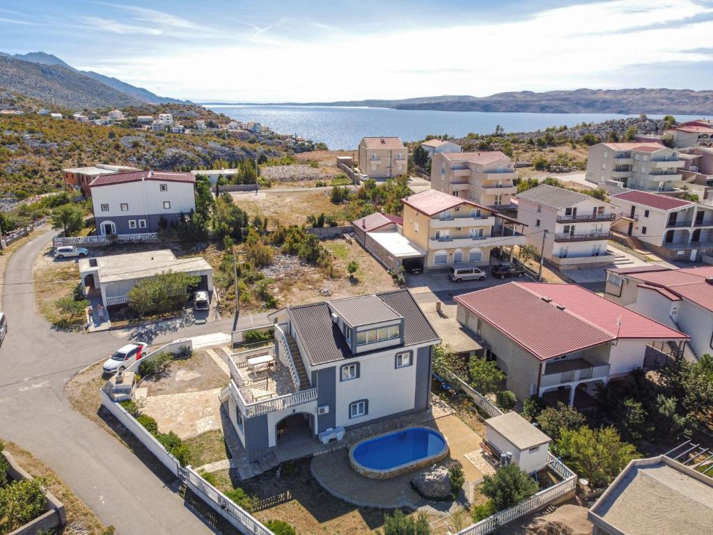 an aerial view of a town with houses and the water at Holiday Home Golic - KBG302 by Interhome in Karlobag