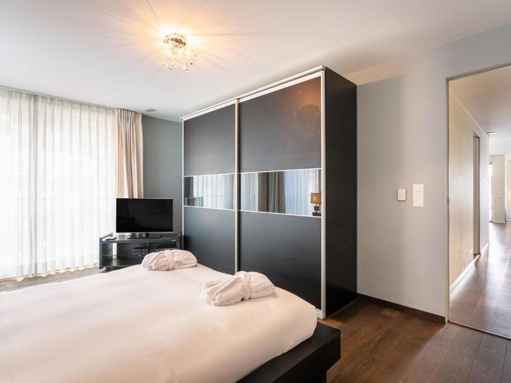 Giường trong phòng chung tại Apartment Le Belvédère D2-6 by Interhome