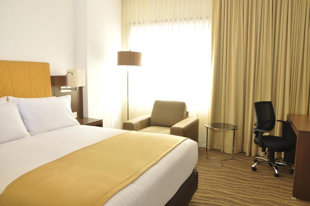 Postel nebo postele na pokoji v ubytování Holiday Inn Express & Suites Bogota Zona Financiera by IHG
