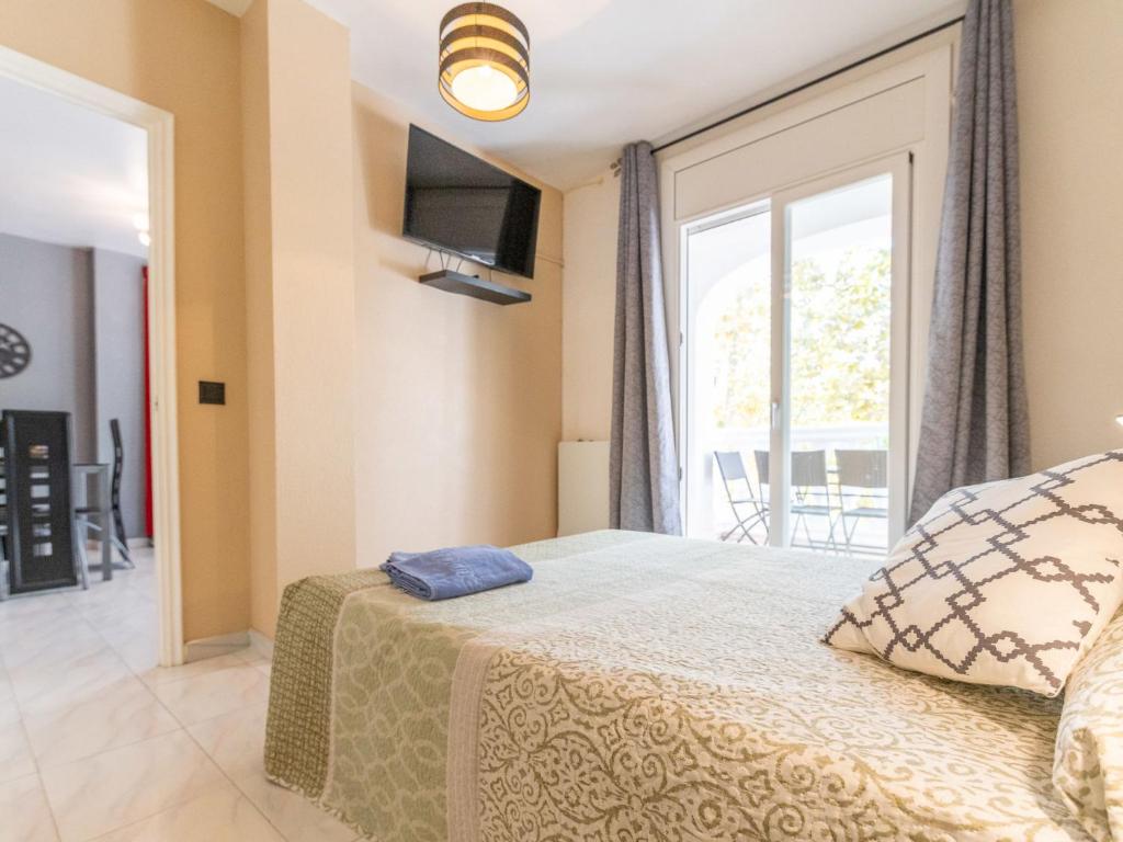 A bed or beds in a room at Apartment Puigmal by Interhome