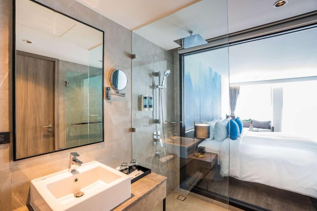 Postel nebo postele na pokoji v ubytování Best Western Plus Nexen Pattaya