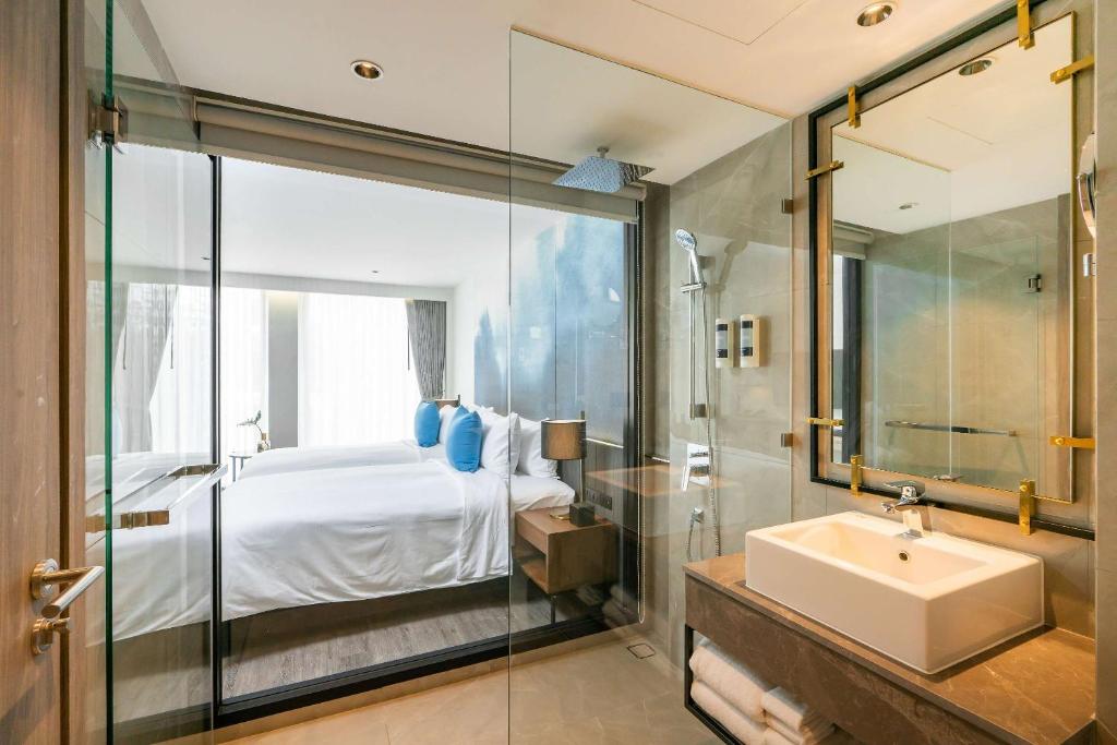 Postel nebo postele na pokoji v ubytování Best Western Plus Nexen Pattaya