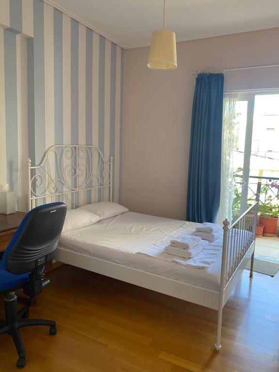 Posteľ alebo postele v izbe v ubytovaní Traditional And Spacious Apartment In Neo Psychiko