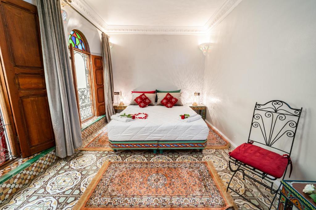 Postel nebo postele na pokoji v ubytování Riad Taj Salma