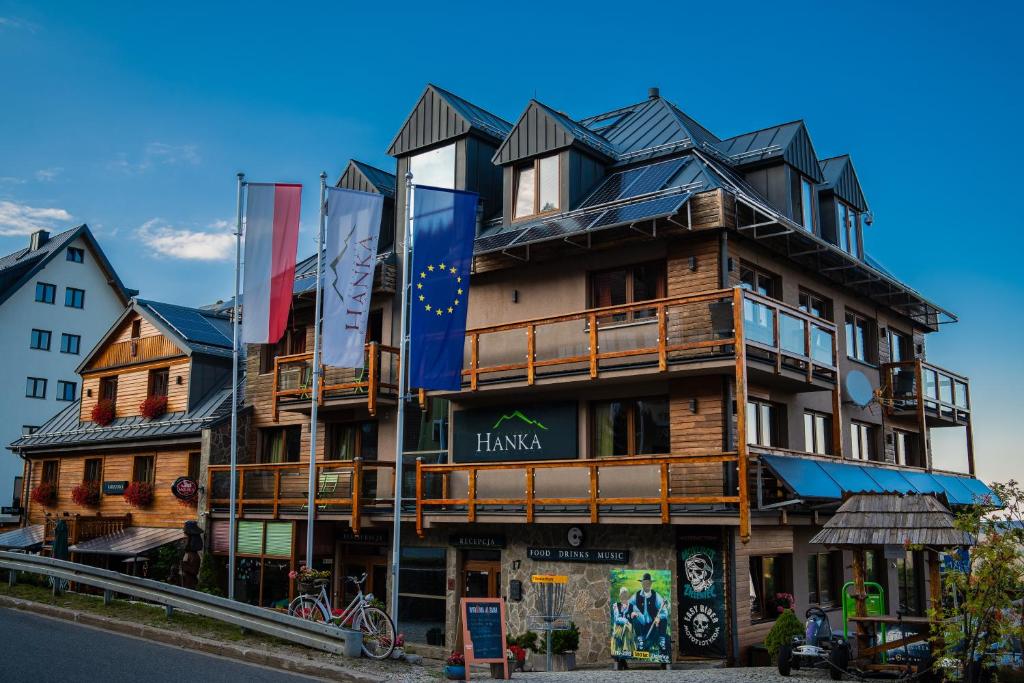 a building with a gambrel roof on top of it at Hanka Relax & Spa in Zieleniec