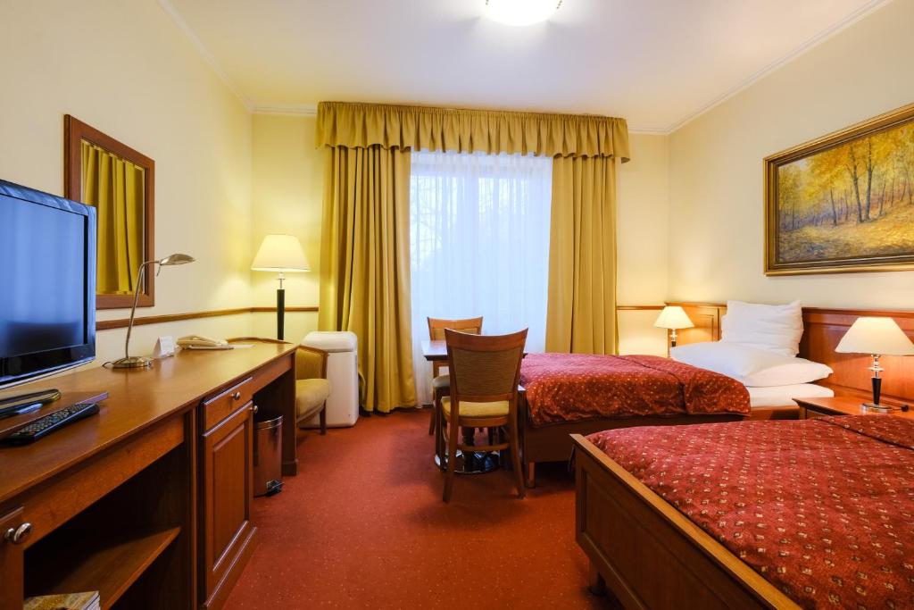 Postel nebo postele na pokoji v ubytování Hotel Matyšák