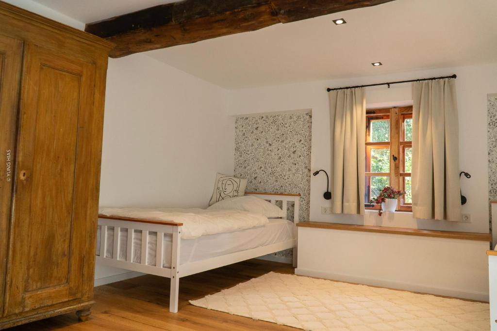 Postel nebo postele na pokoji v ubytování Chalet Schmelz Huette mit Sauna und Garten