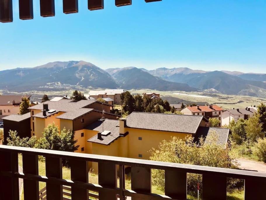 a view from the balcony of a house with mountains in the background at studio cabine Font Romeu in Font Romeu Odeillo Via