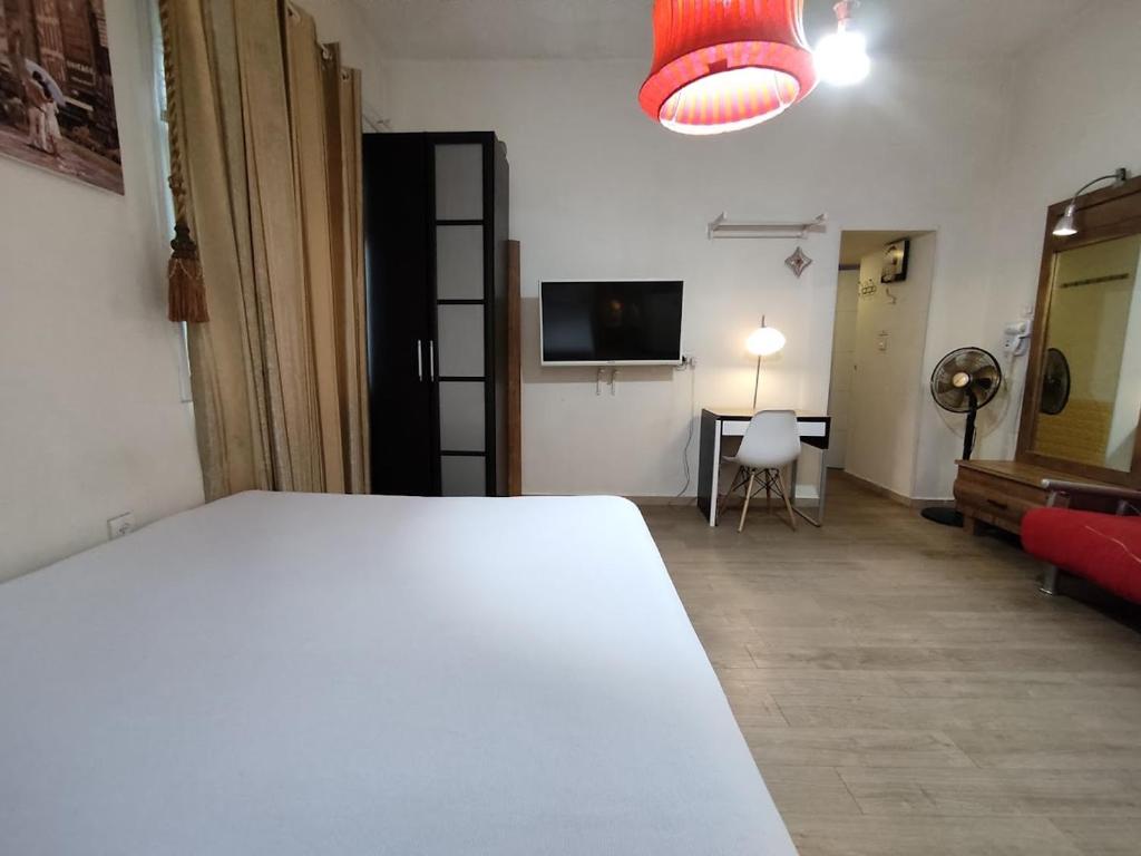 מיטה או מיטות בחדר ב-Private rooms near the beach center