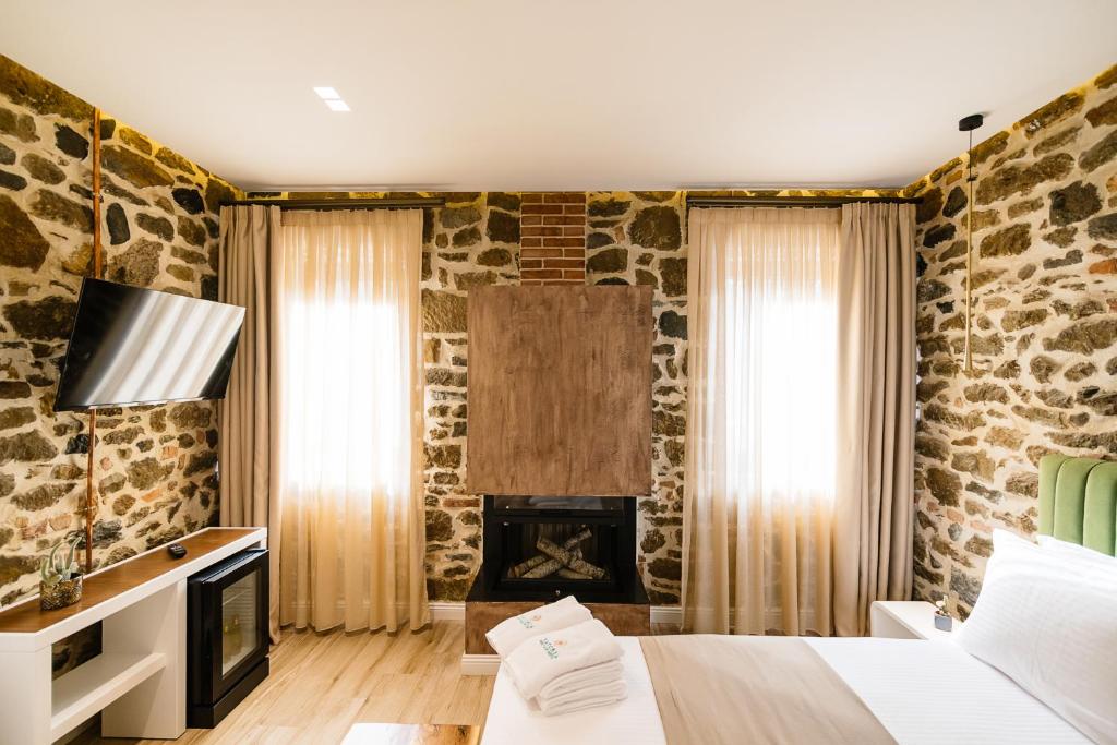 Letto o letti in una camera di Vecchia Boutique Hotel