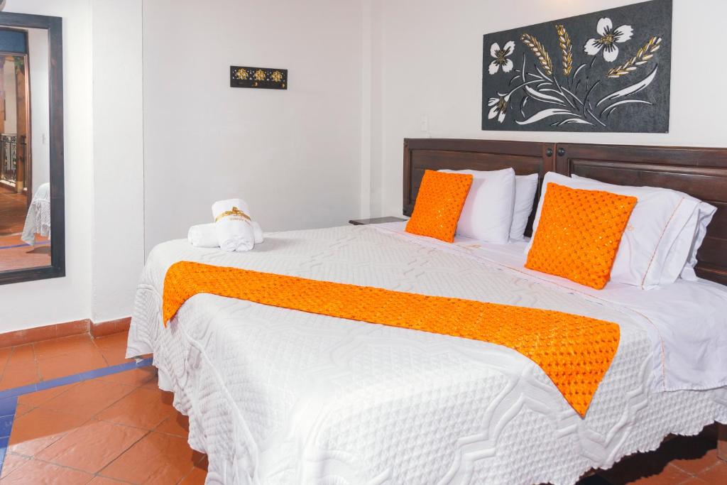 Postel nebo postele na pokoji v ubytování Hotel Cemandy by MA