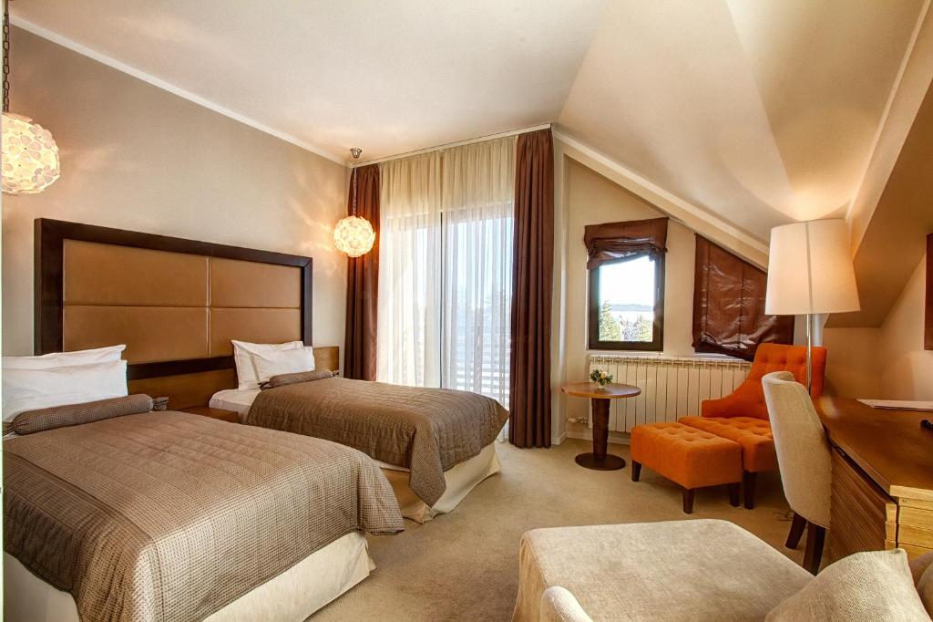 Postel nebo postele na pokoji v ubytování Hotel MIR