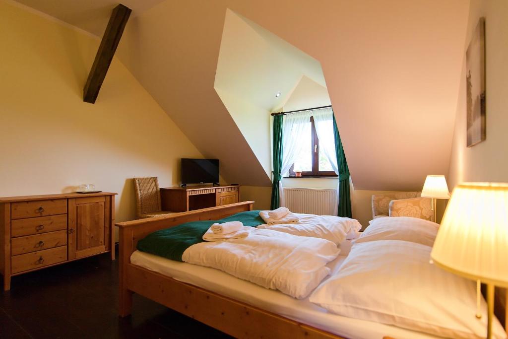 Postel nebo postele na pokoji v ubytování Hotel Buchlov